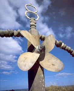 the Rainbow Warrior monument with propeller