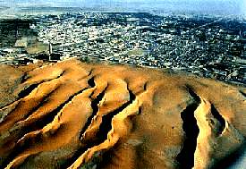 encroaching sand dunes